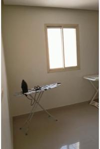 a room with a kite in the corner of a room with a window at نزل الفيحاء in Riyadh