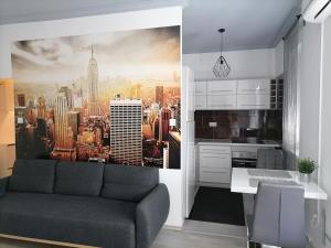 a living room with a view of a city at Mérey Apartment in Szeged