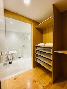 a bathroom with a shower and a sink at Villas Calhau da Lapa 51 in Campanário