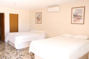 Ένα ή περισσότερα κρεβάτια σε δωμάτιο στο Empalme inn