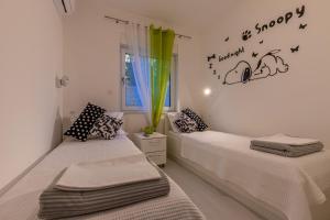 Postel nebo postele na pokoji v ubytování Apartment Rippl II