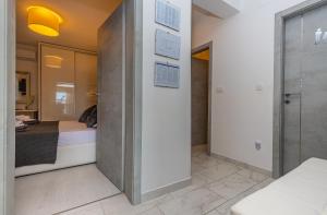 Postel nebo postele na pokoji v ubytování Apartment Rippl II