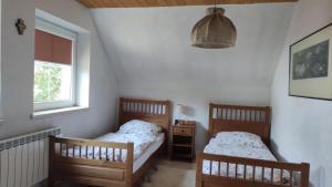 Postel nebo postele na pokoji v ubytování Wielgosówka
