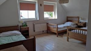 Postel nebo postele na pokoji v ubytování Wielgosówka