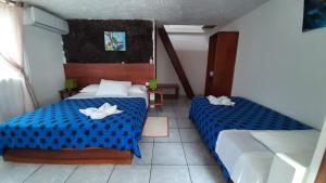 Voodi või voodid majutusasutuse HOSTAL TERO REAL toas
