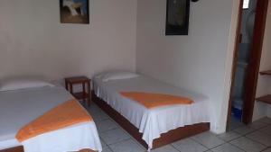 Voodi või voodid majutusasutuse HOSTAL TERO REAL toas