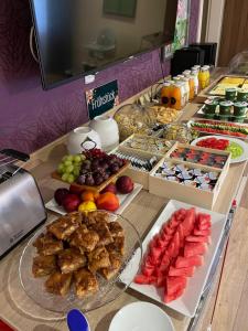 a buffet with many different types of food on a table at Moselina Gästezimmer in Sankt Aldegund