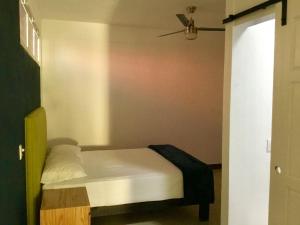 a small bed in a room with a ceiling at One Bedroom Condo Near Beach RG6 in Puerto Vallarta