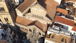 an overhead view of a building with a clock tower at La Suite Del Cavaliere in Amalfi