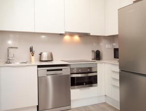Kuchyňa alebo kuchynka v ubytovaní APBCN Eixample Center