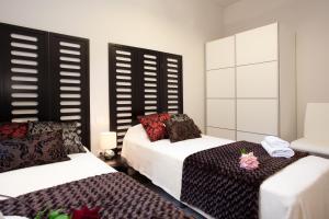 Posteľ alebo postele v izbe v ubytovaní APBCN Eixample Center