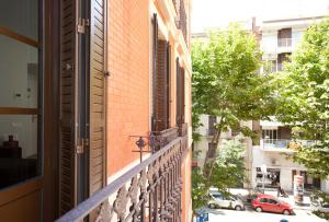 an apartment balcony with a view of a street at APBCN Eixample Center in Barcelona