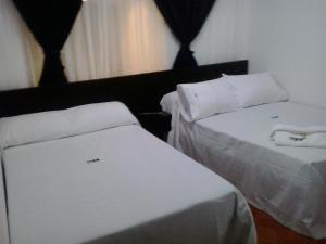 Postel nebo postele na pokoji v ubytování Hotel Casa Gabriela