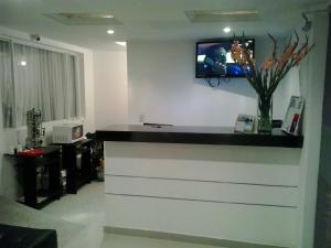 TV a/nebo společenská místnost v ubytování Hotel Casa Gabriela