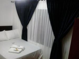 Postel nebo postele na pokoji v ubytování Hotel Casa Gabriela