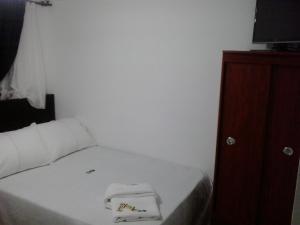 Postel nebo postele na pokoji v ubytování Hotel Casa Gabriela