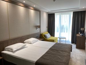 Postel nebo postele na pokoji v ubytování Arletti Hotel + 37 fotografií
