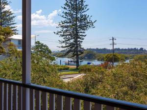 a view of a river from a balcony at Patch of Paradise Iluka in Tea Gardens
