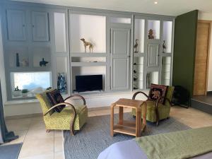 Posezení v ubytování Chambre en Drôme Tropicale