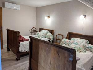 a bedroom with two beds in a room at Gîte Cusey, 3 pièces, 4 personnes - FR-1-611-5 in Cusey