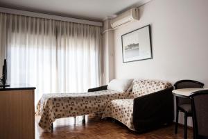 En eller flere senge i et værelse på Hotel Cristoforo Colombo
