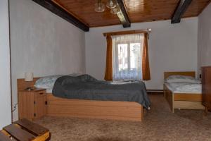 Postel nebo postele na pokoji v ubytování Apartmán ve Mlýně