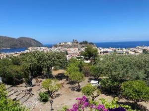 a beach filled with lots of plants and trees at Hotel Villa Diana in Lipari