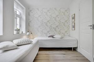 Giường trong phòng chung tại *****elegant feriebolig i hjertet af Kerteminde