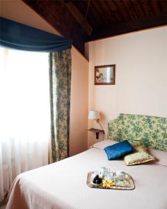 Postel nebo postele na pokoji v ubytování Agriturismo Cavendo Tutus