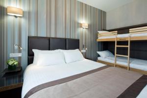 Postelja oz. postelje v sobi nastanitve Hôtel d'Orléans