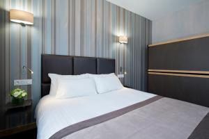 Postelja oz. postelje v sobi nastanitve Hôtel d'Orléans
