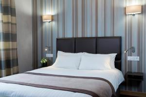 Postelja oz. postelje v sobi nastanitve Hôtel d'Orléans