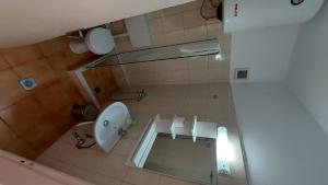 an overhead view of a bathroom with a toilet and mirror at Kapsouli Square Komotini in Komotini