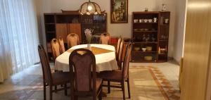 a dining room with a table and chairs at Terezia in Jedľové Kostoľany