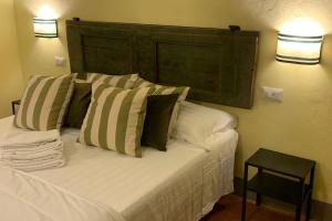 Uma cama ou camas num quarto em Azienda Agricola Maremma Bio
