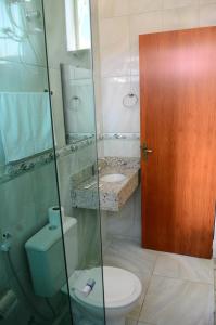 Um banheiro em Hotel Pousada JM Ferreira