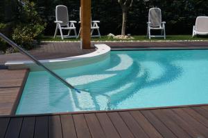 The swimming pool at or close to Residence Rivachiara (check-in at Hotel Riviera in Viale Rovereto, 95)
