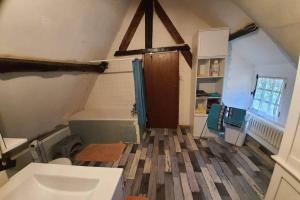 an attic room with a toilet and a door at Chaumière du Château d'ô et sa mini ferme ,Gite 21couchages in Goupillières +58 photos