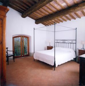A bed or beds in a room at La Spinetta