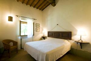 A bed or beds in a room at La Spinetta