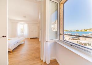 Posteľ alebo postele v izbe v ubytovaní Central Seaside Residence