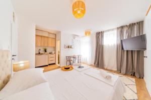 Posteľ alebo postele v izbe v ubytovaní Central Seaside Residence