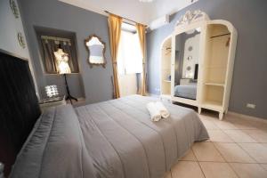 Ένα ή περισσότερα κρεβάτια σε δωμάτιο στο Sicilian Mood - Piscarìa +9 φωτογραφίες