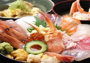 a bowl of food with sushi and other foods at APA Hotel Kanazawa Ekimae in Kanazawa