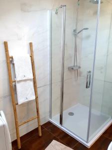 a shower stall with a glass door in a bathroom at Ardura shimmering on the sea in Mlini +33 photos