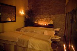 Postel nebo postele na pokoji v ubytování MAJU HOTEL CAMPESTRE & SPA
