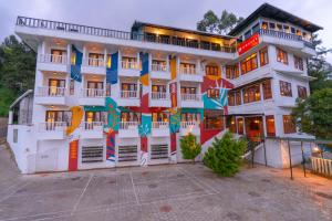 a building with a mural on the side of it at Zostel Munnar in Munnar