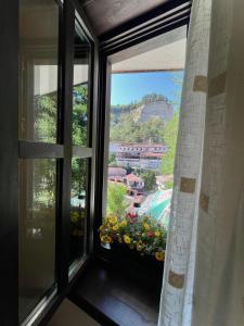 a window with a view of a mountain at Hotel Slavova Krepost in Melnik