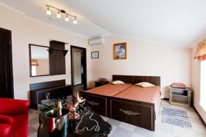 Posteľ alebo postele v izbe v ubytovaní Dergachov Guest House