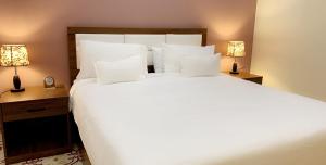 Кровать или кровати в номере برج الأعمال
